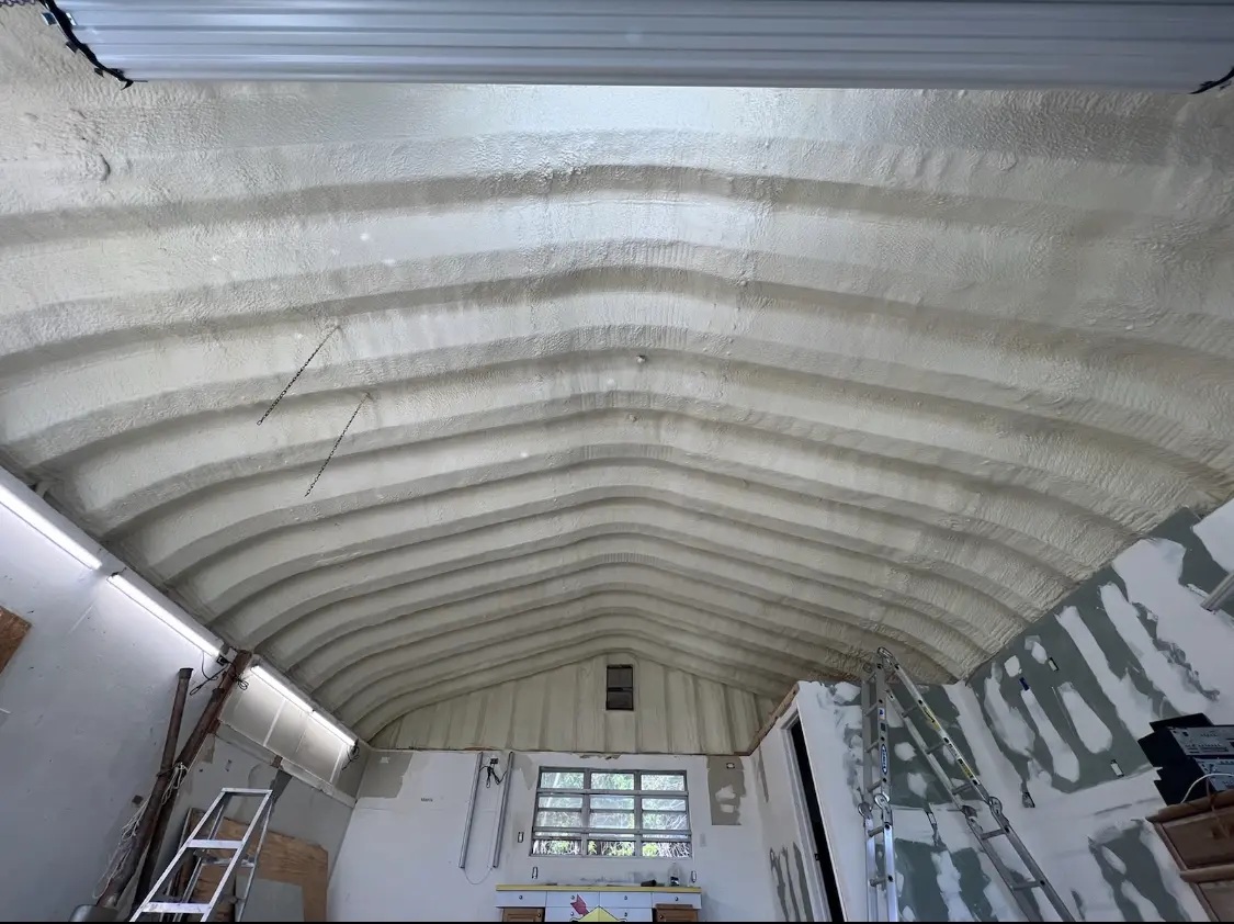Spray polyurethane foam applied to the underside of a metal roof deck in San Carlos